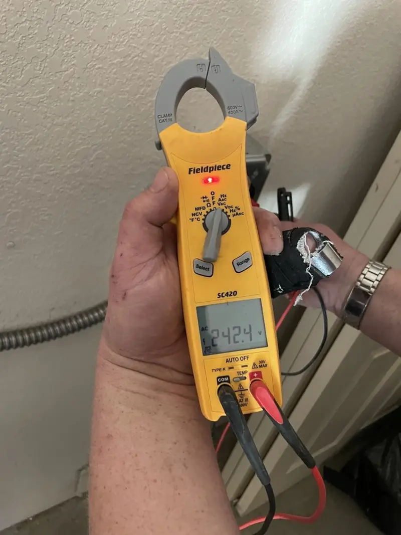 Voltage testing with clamp meter during Outlet Installation in Moosic